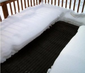 Heating mat on wheelchair ramp landing